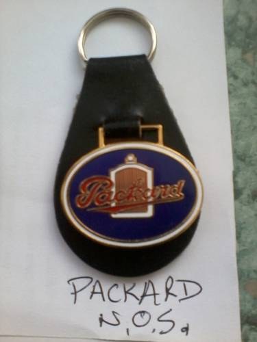 1950   PACKARD AMERICAN keyring and badges. SOLD