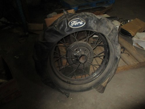 1928 Ford Model A wire spoke wheel with tire cover For Sale