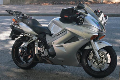 Silver Honda VFR 800 (2002) with luggage SOLD