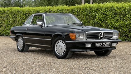 500SL (R107) Rare and original solid black with grey leather