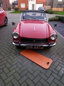Picture of MG Midget ,Red ,wire wheels canvas hood.