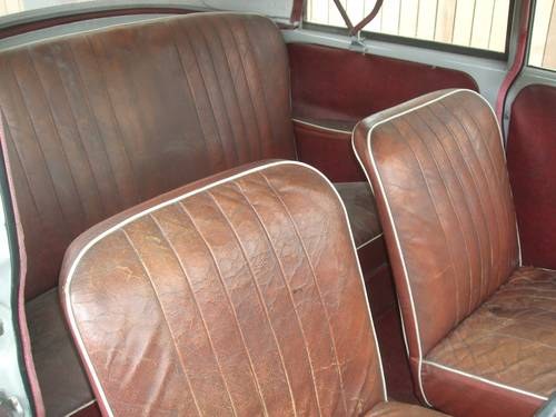 1957 Dove Grey Genuine Convertible with Maroon Leather Interior SOLD