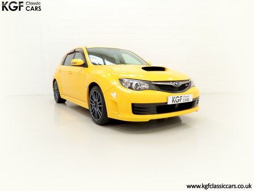 2009 A Subaru Impreza WRX STI Spec C in Exclusive Sunrise Yellow. SOLD