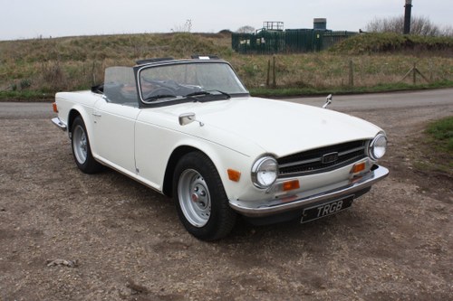 TWO OWNER 1973 TR6 IN TRIUMPH WHITE WITH BLACK TRIM. SOLD