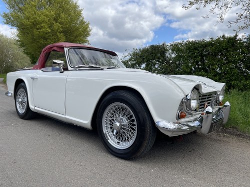 BEAUTIFUL WHITE 1965 TRIUMPH TR4 WITH OVERDRIVE. SOLD